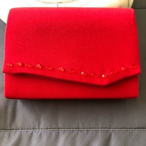 Soft red handbag with optional strap